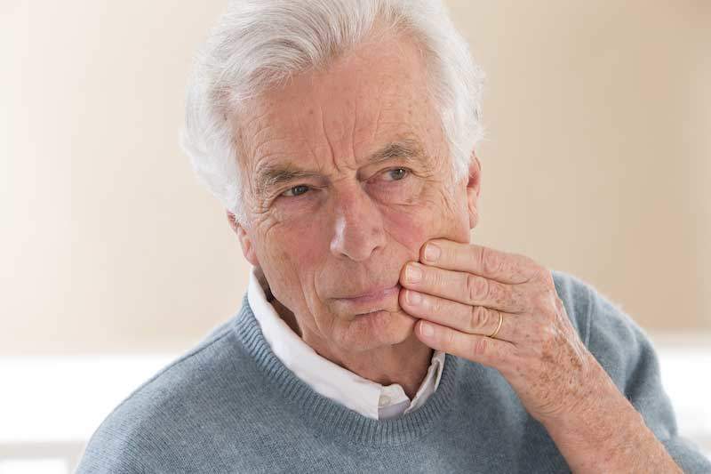 toothache, oral health problem in an elderly man